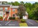 Attractive brick townhome with a two-car garage and visitor parking at 120 Rosewall Ln, Cary, NC 27511