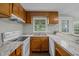 Kitchen with wood cabinets, granite countertops, and a window at 35 & 59 Paulfield Ln, Bunnlevel, NC 28323