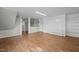 Spacious living room featuring wood floors, built-in shelving, and a brick fireplace at 35 & 59 Paulfield Ln, Bunnlevel, NC 28323