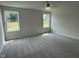 Well-lit bedroom with plush carpeting and large windows at 170 Lotus Ave, Smithfield, NC 27577