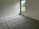 Bright bedroom featuring neutral wall and carpet at 170 Lotus Ave, Smithfield, NC 27577