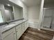 Double vanity bathroom with granite countertop and garden tub at 170 Lotus Ave, Smithfield, NC 27577