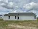 Rear view of a light gray house with a small patio at 170 Lotus Ave, Smithfield, NC 27577
