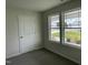 Bright bedroom with two windows and view of street at 170 Lotus Ave, Smithfield, NC 27577