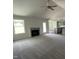 Spacious living room with a fireplace and high ceilings at 152 Lotus Ave, Smithfield, NC 27577