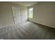 Bright bedroom with neutral walls and plush carpeting at 116 Lotus Ave, Smithfield, NC 27577