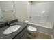 Bathroom with granite countertop vanity and a shower/tub combo at 116 Lotus Ave, Smithfield, NC 27577