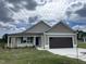 Charming single-story home with a two-car garage and well-maintained landscaping at 116 Lotus Ave, Smithfield, NC 27577