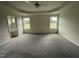 Spacious main bedroom with plush carpeting and en-suite bathroom access at 116 Lotus Ave, Smithfield, NC 27577