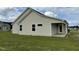 Tan vinyl siding house with covered patio at 116 Lotus Ave, Smithfield, NC 27577