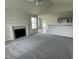 Spacious living room with a fireplace, high ceilings, and ample natural light at 116 Lotus Ave, Smithfield, NC 27577
