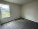 Well-lit bedroom with a window and neutral walls at 116 Lotus Ave, Smithfield, NC 27577