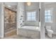 Spa-like bathroom featuring a soaking tub, walk-in shower, and built-in shelves at 1618 Ben Wilson Rd, Mebane, NC 27302