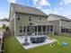 Spacious backyard with patio, lawn, and play area at 609 Meadowgrass Ln, Wake Forest, NC 27587