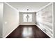 Spacious dining area with dark hardwood floors and an accent wall at 609 Meadowgrass Ln, Wake Forest, NC 27587