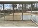 Screened porch overlooking the backyard, providing ample outdoor space at 609 Meadowgrass Ln, Wake Forest, NC 27587