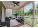 Relaxing screened porch with wicker furniture, offering a peaceful backyard view at 609 Meadowgrass Ln, Wake Forest, NC 27587