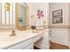 Elegant powder room with ornate wallpaper and gold accents at 808 N Lincoln St, Benson, NC 27504