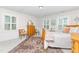 Charming bedroom with hardwood floors and plenty of natural light at 808 N Lincoln St, Benson, NC 27504