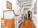 Elegant entryway with hardwood floors, a grand staircase, and tasteful decor at 808 N Lincoln St, Benson, NC 27504