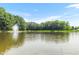 Serene pond with a fountain, surrounded by lush greenery at 808 N Lincoln St, Benson, NC 27504