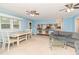 Living area with light blue walls, gray sofa and glass coffee table at 816 Luby Smith Rd, Princeton, NC 27569