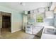 View of kitchen with white cabinets and appliances at 260 S Rocky River Rd, Moncure, NC 27559