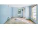 Empty bedroom with light blue walls and carpet at 260 S Rocky River Rd, Moncure, NC 27559