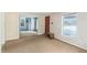 Living room features wood paneling and carpeted floors at 260 S Rocky River Rd, Moncure, NC 27559