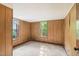 Bedroom with wood paneling, carpet, and window at 260 S Rocky River Rd, Moncure, NC 27559