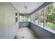 Spacious screened porch overlooks the backyard, perfect for relaxing at 260 S Rocky River Rd, Moncure, NC 27559