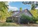 Gray house with screened porch and mature landscaping at 260 S Rocky River Rd, Moncure, NC 27559