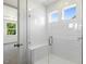 Large walk-in shower with subway tile and bench at 113 Quail Point Cir, Clayton, NC 27520