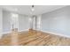 Bedroom with hardwood floors and access to walk-in closet at 1610 Carson St, Raleigh, NC 27608