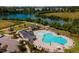 Aerial view of community pool, clubhouse, and lake at 605 Hillfarm Dr, Wake Forest, NC 27587