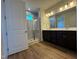 Double vanity bathroom with shower and vinyl flooring at 605 Hillfarm Dr, Wake Forest, NC 27587