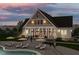 Community clubhouse with pool and outdoor seating areas at 605 Hillfarm Dr, Wake Forest, NC 27587