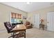 Comfortable bedroom with desk and two chairs at 6825 Palaver Ln, Cary, NC 27519