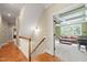 Upstairs hallway with hardwood floors and staircase at 6825 Palaver Ln, Cary, NC 27519