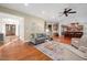 Open living room with hardwood floors, and views to the kitchen at 6825 Palaver Ln, Cary, NC 27519