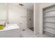 Updated bathroom with walk-in shower and built-in shelving at 221 W Dale Dr, Oxford, NC 27565