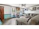 Bright living room with large windows and comfortable sectional sofa at 229 Turnipseed Rd, Wendell, NC 27591