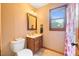 Bathroom with wooden vanity and shower at 229 Turnipseed Rd, Wendell, NC 27591