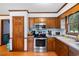 Kitchen boasts stainless steel appliances and wood cabinets at 229 Turnipseed Rd, Wendell, NC 27591