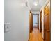Long hallway with light walls and wood flooring at 229 Turnipseed Rd, Wendell, NC 27591