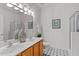 Double vanity bathroom with a large mirror and walk in shower at 215 Eyam Hall Ln, Apex, NC 27502