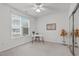 Spacious bedroom with large window and mirrored closet at 215 Eyam Hall Ln, Apex, NC 27502