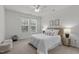 Bedroom featuring a double bed, ceiling fan, and ample natural light at 215 Eyam Hall Ln, Apex, NC 27502