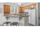 Modern kitchen with granite countertops and wood cabinets at 215 Eyam Hall Ln, Apex, NC 27502