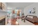 Living room, kitchen, and dining area with hardwood floors at 215 Eyam Hall Ln, Apex, NC 27502